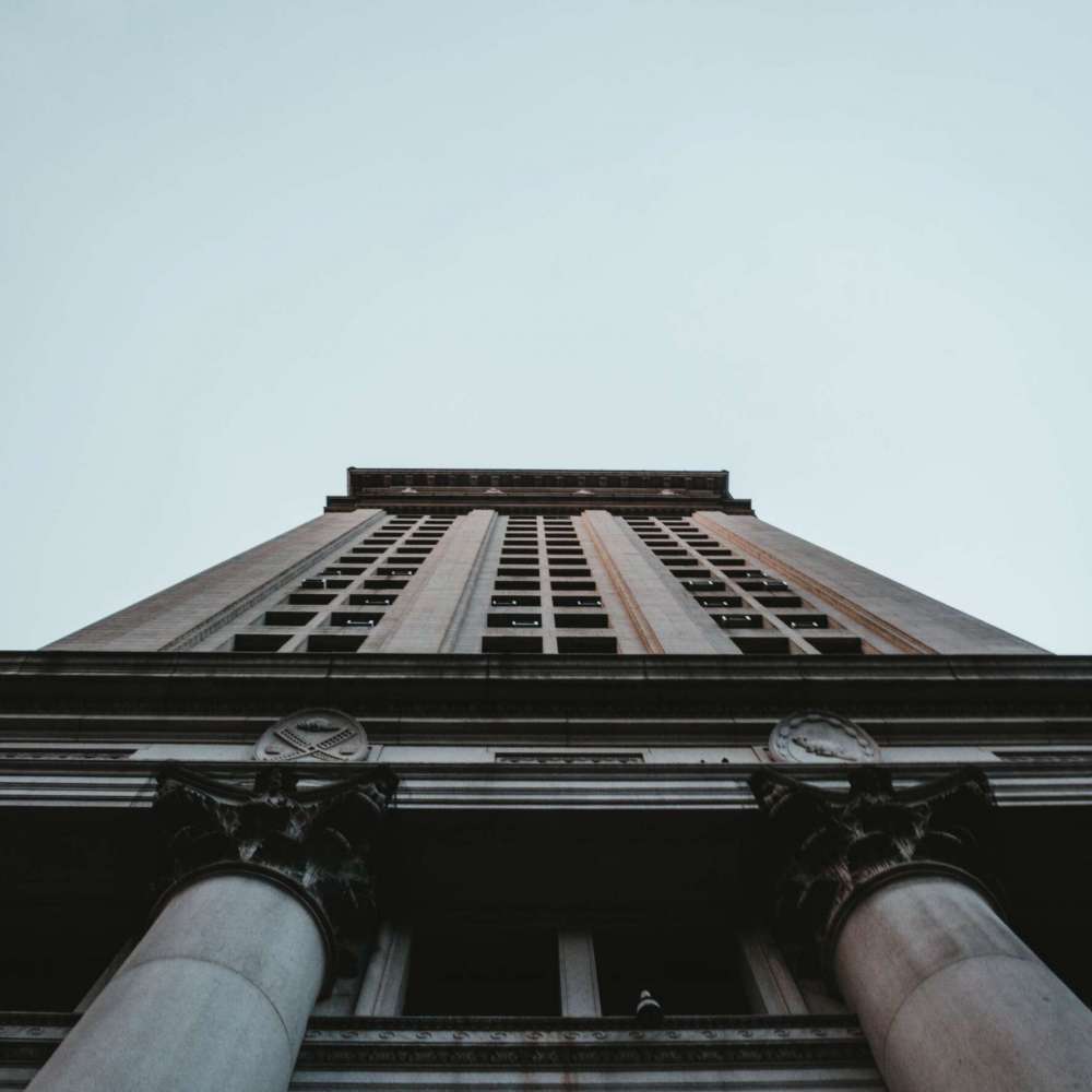 low-angle-shot-tall-business-building-nyc (1) (1)